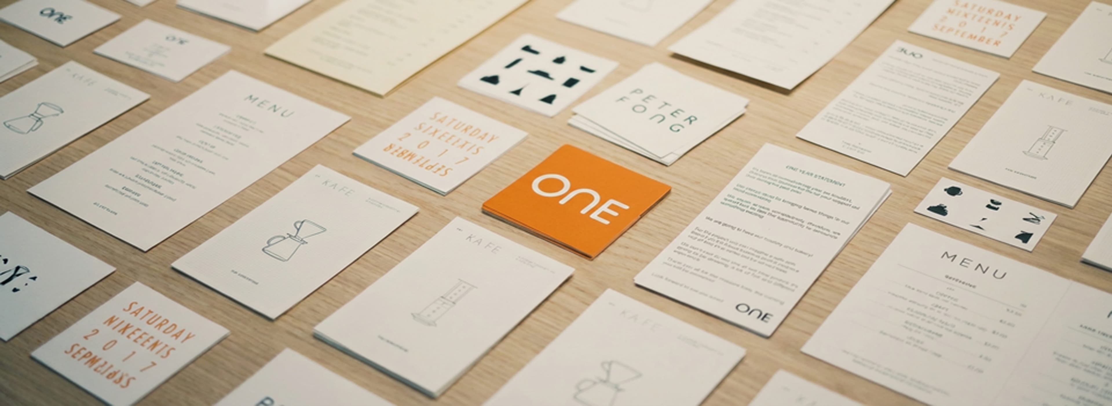 Brand creative workspace with sketches, color swatches, and laptop for local business identity work